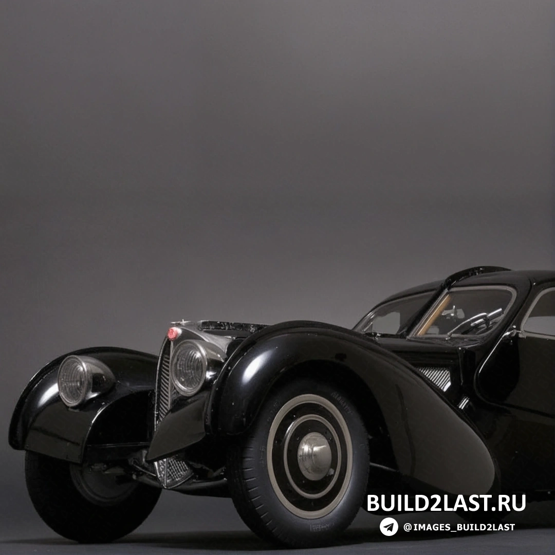 Черный спортивный автомобиль Bugatti Type 57SC Atlantic, вид сбоку