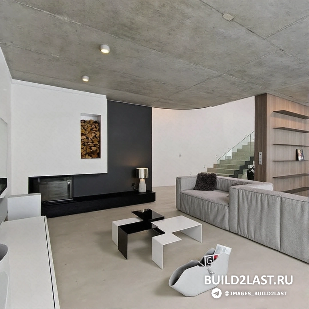 Лофт-холл с бетонными и стеклянными акцентами в темных оттенках